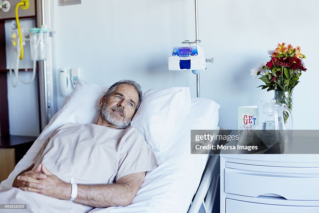 Thoughtful man relaxing in hospital ward