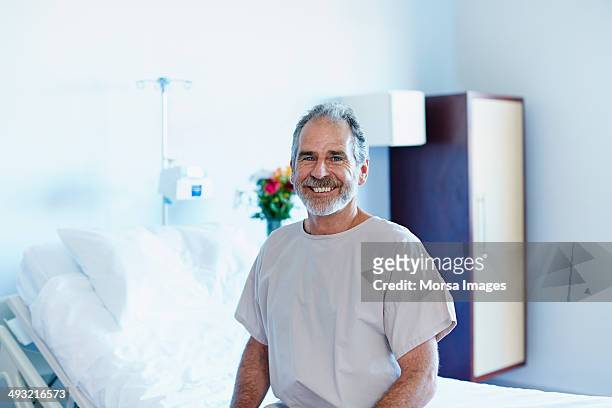 happy man in hospital ward - image of patient imagens e fotografias de stock