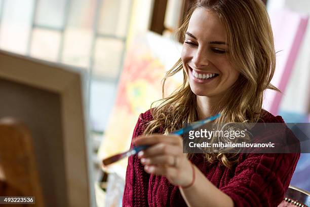 female painter - artist easel stock pictures, royalty-free photos & images