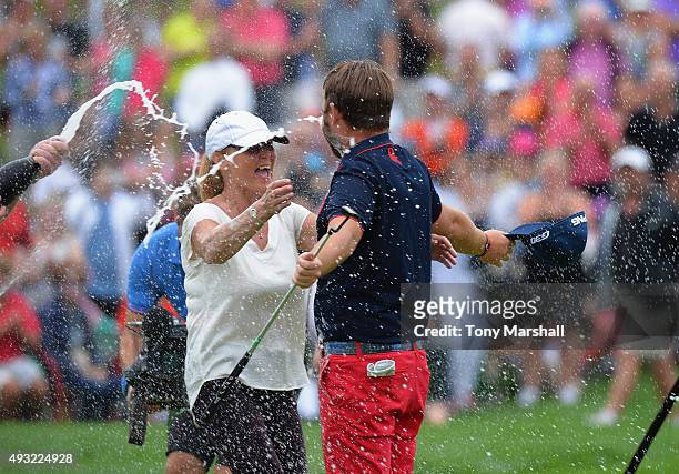Andy Sullivan of England is congratulated by his mum as he is covered in champagne after winning the Portugal Masters at Oceanico Victoria Golf Club...