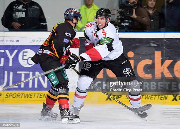 Manuel Strodel of the Duesseldorfer EG and Per Ãslund of the Koelner Haien during the game between the Duesseldorfern EG and Koelner Haien on October...