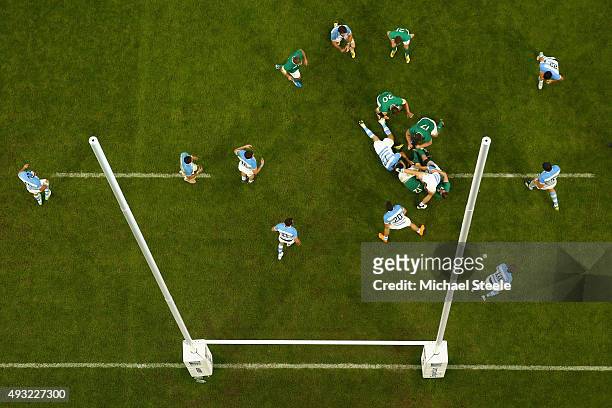 Robbie Henshaw of Ireland is held up by Lucas Noguera Paz of Argentina during the 2015 Rugby World Cup Quarter Final match between Argentina and...