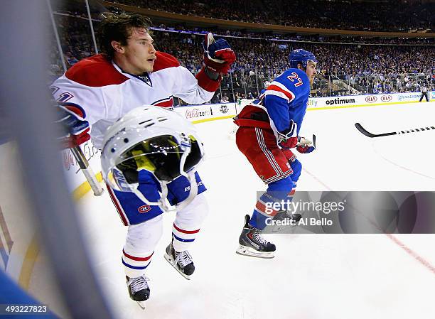 Brendan Gallagher of the Montreal Canadiens looses his helmet against Ryan McDonagh of the New York Rangers in Game Three of the Eastern Conference...