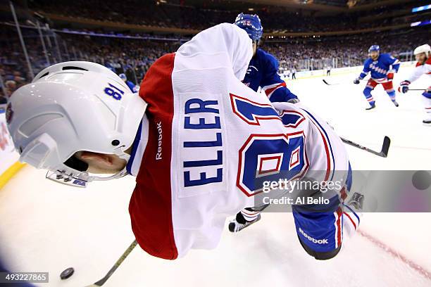 Brian Boyle of the New York Rangers checks Brendan Gallagher of the Montreal Canadiens into the boards in Game Three of the Eastern Conference Final...