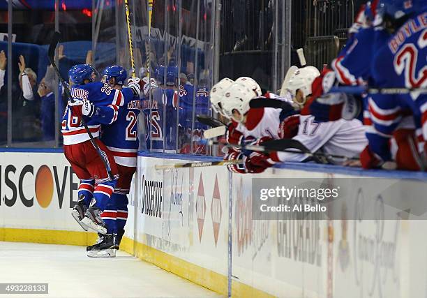 Chris Kreider of the New York Rangers celebrates his goal with Martin St. Louis late in the third period against the Montreal Canadiens in Game Three...
