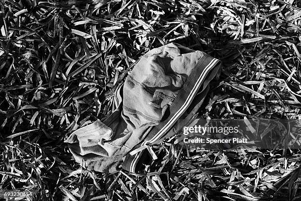 Pair of mens underwear lays next to other items discarded by migrants arriving by boat from Turkey along a Lesbos beach where thousands of objects...