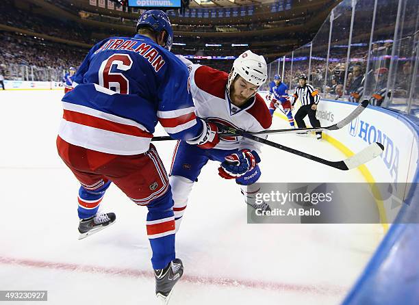 Brandon Prust of the Montreal Canadiens gets tangled up against Anton Stralman of the New York Rangers in Game Three of the Eastern Conference Final...