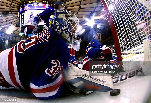 Henrik Lundqvist and Chris Kreider of the New York Rangers watches Daniel Briere of the Montreal Canadiens goal into the back of the net in Game...