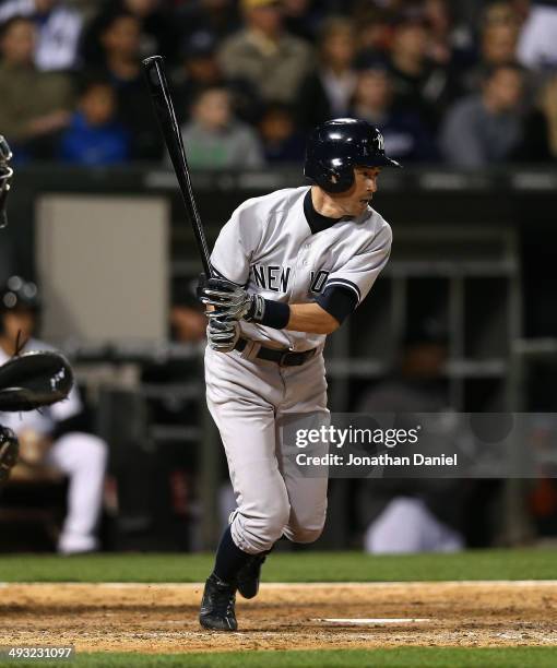Ichiro Suzuki of the New York Yankees hits a pinch-hit single in the 9th inning against the Chicago White Sox at U.S. Cellular Field on May 22, 2014...