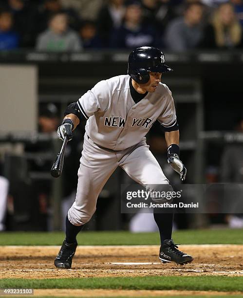 Ichiro Suzuki of the New York Yankees runs after hitting a pinch-hit single in the 9th inning against the Chicago White Sox at U.S. Cellular Field on...
