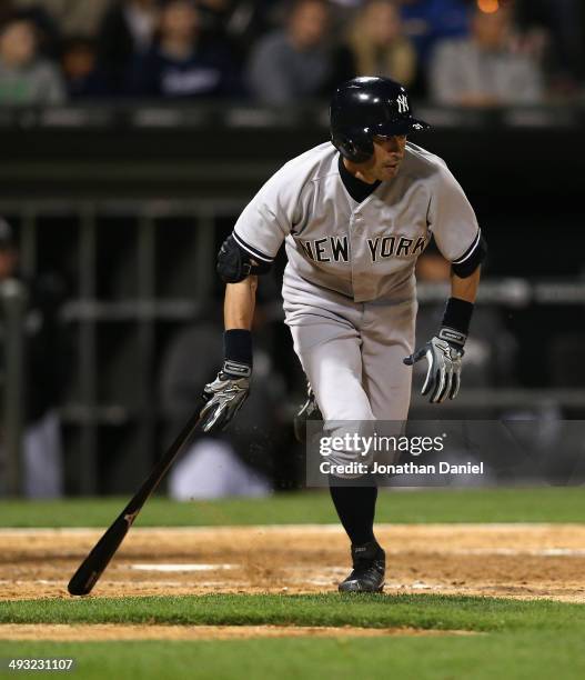 Ichiro Suzuki of the New York Yankees runs after hitting a pinch-hit single in the 9th inning against the Chicago White Sox at U.S. Cellular Field on...