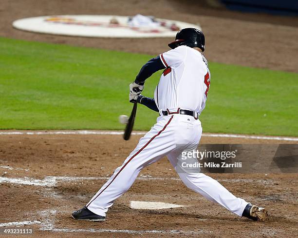 Pinch hitter Ryan Doumit of the Atlanta Braves connects for a go-ahead two-run RBI single during the game against the Milwaukee Brewers at Turner...