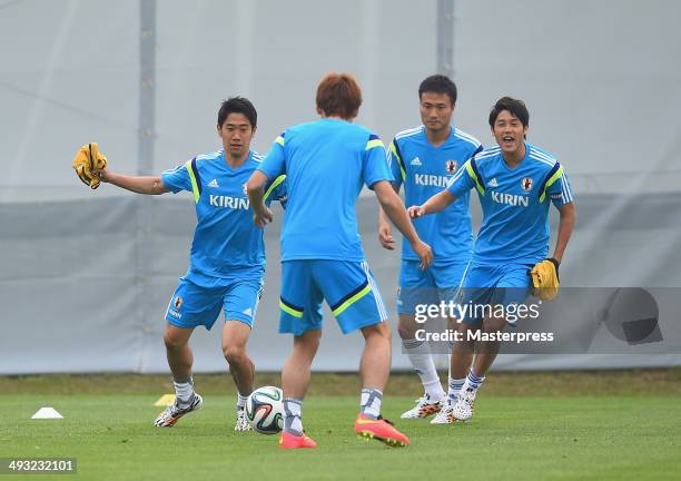 Shinji Kagawa, Yuka Osako, Yasuyuki Konno and Atsuto Uchida of Japan in action during the training session on May 22, 2014 in Ibusuki, Kagoshima,...