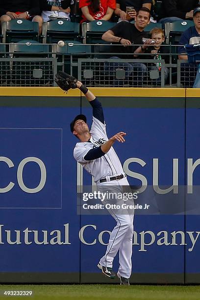 Right fielder Michael Saunders of the Seattle Mariners catches a deep fly ball off the bat of L.J. Hoes of the Houston Astros in the fourth inning at...