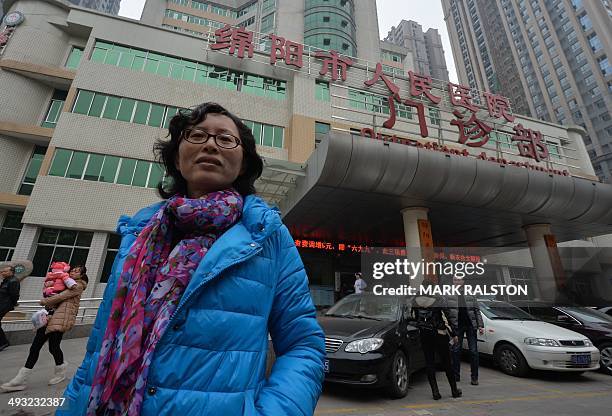 This photo taken on February 23, 2014 shows doctor Lan Yuefeng, a former hospital ultrasound chief standing outside the Mianyang People's Hospital...