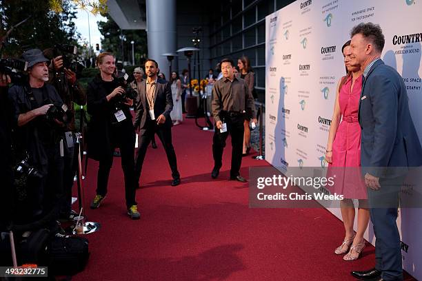 Musician Lyle Lovett and April Kimble attend the Annenberg Space for Photography Opening Celebration for "Country, Portraits of an American Sound" at...