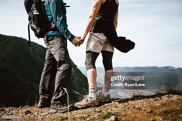 adult hikers on mountain top - columbia river gorge stock pictures, royalty-free photos & images