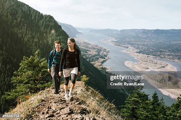 fit mature adults on mountain hike - columbia river gorge oregon stock pictures, royalty-free photos & images