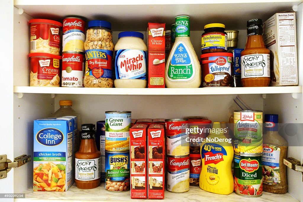 Kitchen pantry shelves filled with groceries