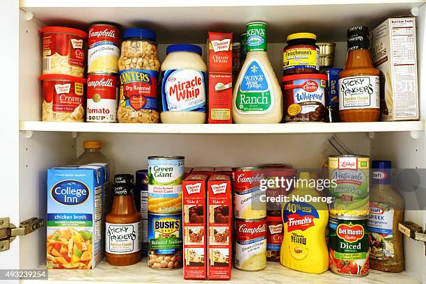 kitchen pantry shelves filled with groceries - ready to eat stock pictures, royalty-free photos & images