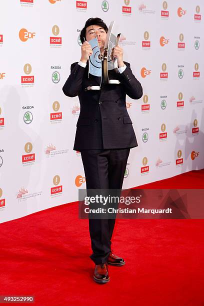 Lang Lang poses with his Instrumentalist of the Year/Piano award and special award for the Lang Lang International Music Foundation honored at the...