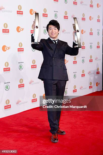 Lang Lang poses with his Instrumentalist of the Year/Piano award and special award for the Lang Lang International Music Foundation honored at the...