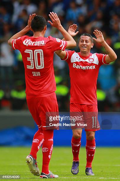 Carlos Esquivel of Toluca celebrates with his teammate Jordan Silva after scoring the second goal of his team during the 13th round match between...