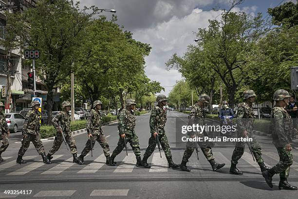 Thai soldiers patrol near government buildings on May 23, 2014 in Bangkok, Thailand. The Army chief announced in an address to the nation that the...