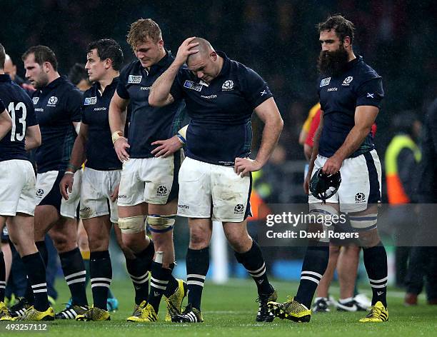Dejected Scotland players react following their team's 35-34 defeat during the 2015 Rugby World Cup Quarter Final match between Australia and...