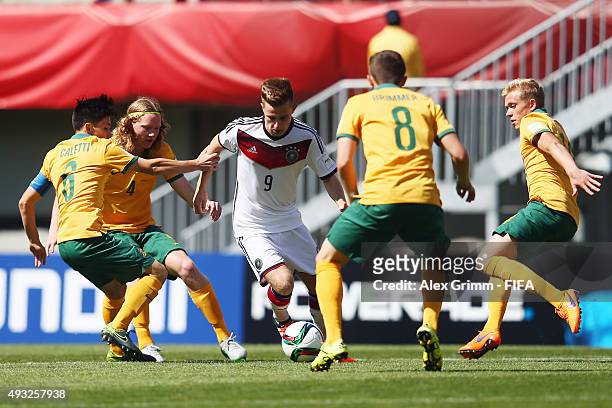 Johannes Eggestein of Germany is challenged by Joe Caletti, Kye Rowles, Jake Brimmer and Joshua Laws of Australia during the FIFA U-17 World Cup...