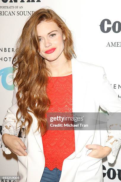 Holland Roden arrives at the exhibit opening of "Country: Portraits Of An American Sound" held at Annenberg Space For Photography on May 22, 2014 in...