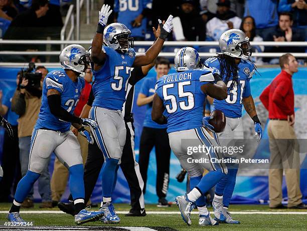 Rashean Mathis of the Detroit Lions celebrates with teammates after a third quarter interception in the end zone against the Chicago Bears at Ford...