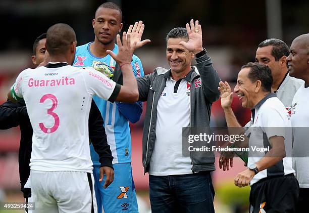 Rodrigo of Vasco celebrates scoring the second goal with his head coach Jorginho during the match between Sao Paulo and Vasco for the Brazilian...