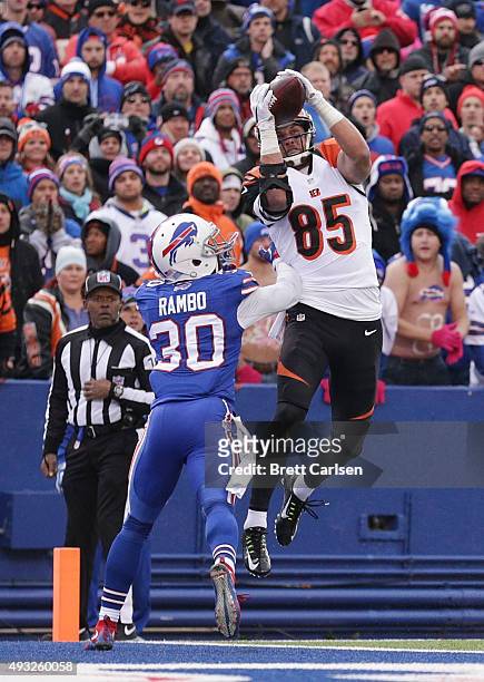 Tyler Eifert of the Cincinnati Bengals catches a touchdown pass in front of Bacarri Rambo of the Buffalo Bills during the second half at Ralph Wilson...