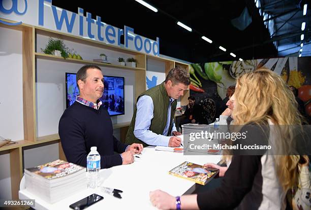 Chefs Bobby Deen and Jamie Deen and pose with their books at the Grand Tasting presented by ShopRite featuring Samsung Culinary Demonstrations...