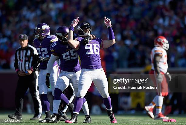 Harrison Smith, Anthony Barr and Brian Robison of the Minnesota Vikings celebrate a fumble recovery by Robison during the fourth quarter of the game...