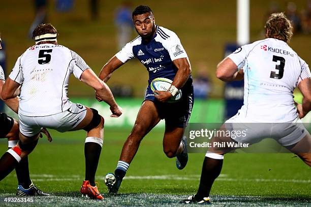 Lolagi Visinia of the Blues runs at the Sharks defence during the round 15 Super Rugby match between the Blues and the Sharks at North Harbour...