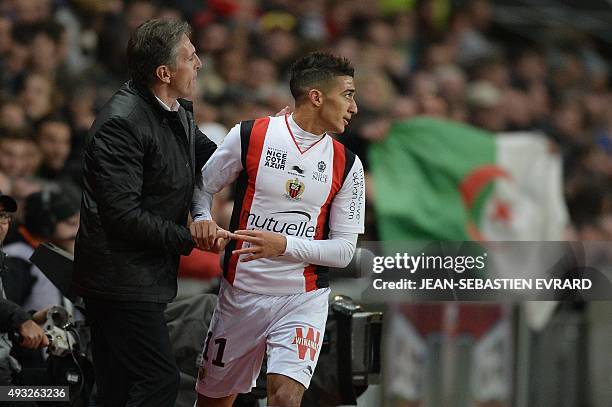 Nice's Algerian forward Said Benrahma celebrates with his coach Nice's French head coach Claude Puel after scoring during the French L1 football...