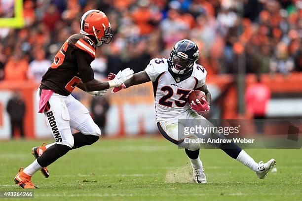 Running back Ronnie Hillman of the Denver Broncos looks get around cornerback Pierre Desir of the Cleveland Browns during the fourth quarter at...