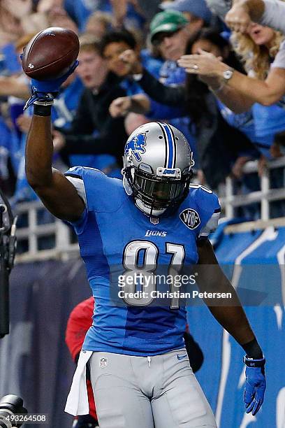 Wide receiver Calvin Johnson of the Detroit Lions celebrates after catching a six yard touchdown reception against the Chicago Bears during the...