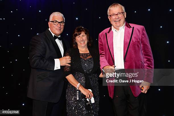 Mitch Winehouse, Janis Seaton and Christopher Biggins attend the Amy Winehouse Foundation Gala at The Savoy Hotel on October 15, 2015 in London,...