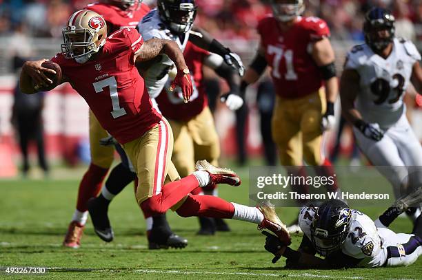 Quarterback Colin Kaepernick of the San Francisco 49ers is tackled by cornerback Jimmy Smith of the Baltimore Ravens during their NFL game at Levi's...