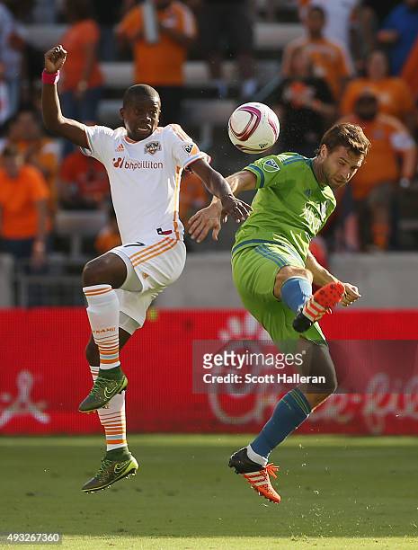 Andreas Ivanschitz of the Seattle Sounders FC and Boniek Garcia of the Houston Dynamo battle for the ball in the first half of their game at BBVA...