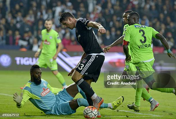 Mario Gomez of Besiktas in action against Charles Itandje and Ousmane Viera of Caykur Rizespor during the Turkish Spor Toto Super League football...