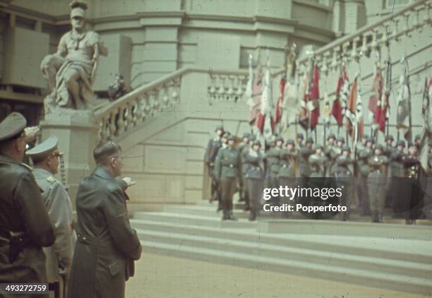 German Chancellor Adolf Hitler salutes an audience of high ranking military figures during a speech in Potsdam, Germany circa 1940.