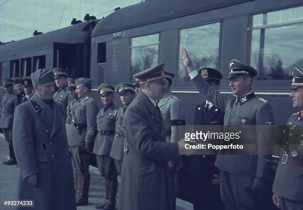 1st OCTOBER: German Chancellor Adolf Hitler meets with Italian Prime Minister Benito Mussolini and Axis officers at the railway station in Florence,...