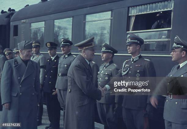 1st OCTOBER: German Chancellor Adolf Hitler meets with Italian Prime Minister Benito Mussolini and Axis officers at the railway station in Florence,...