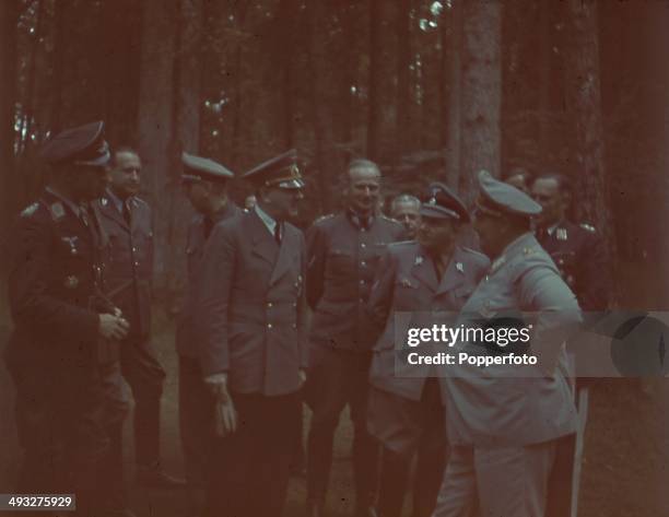 German Chancellor Adolf Hitler pictured with various Generals and high ranking officials including Hermann Goering on far right and Martin Bormann...