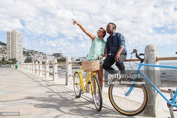 african couple looking at a really cool building - cape town beach stock pictures, royalty-free photos & images