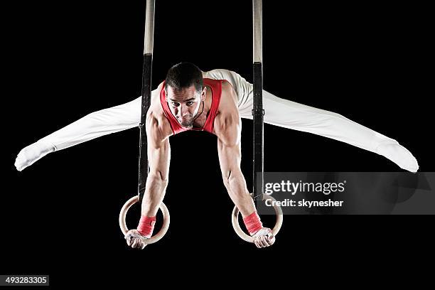 man on gymnastics rings. - gymnastic rings equipment bildbanksfoton och bilder